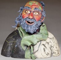 front view of ceramics sculpture of homeless man